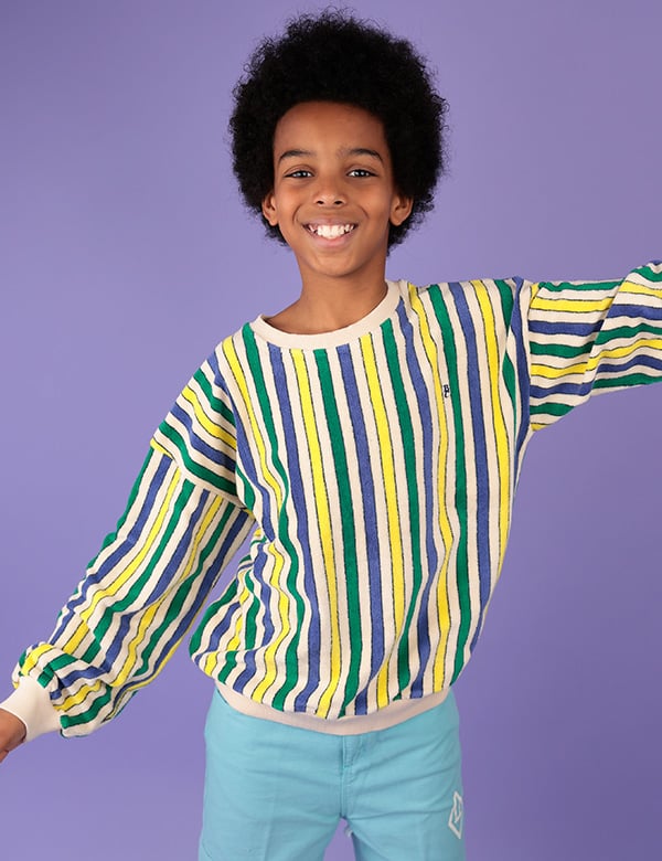 Kinderlijk model met bruin krullend haar en bruine ogen Gabriel A.