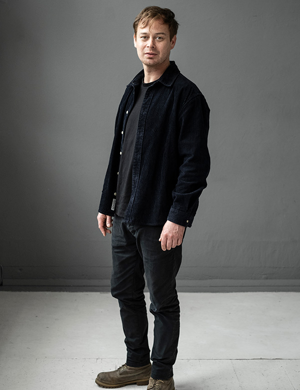 Mannelijk model met roodbruin haar en bruin-groene ogen Joost W.