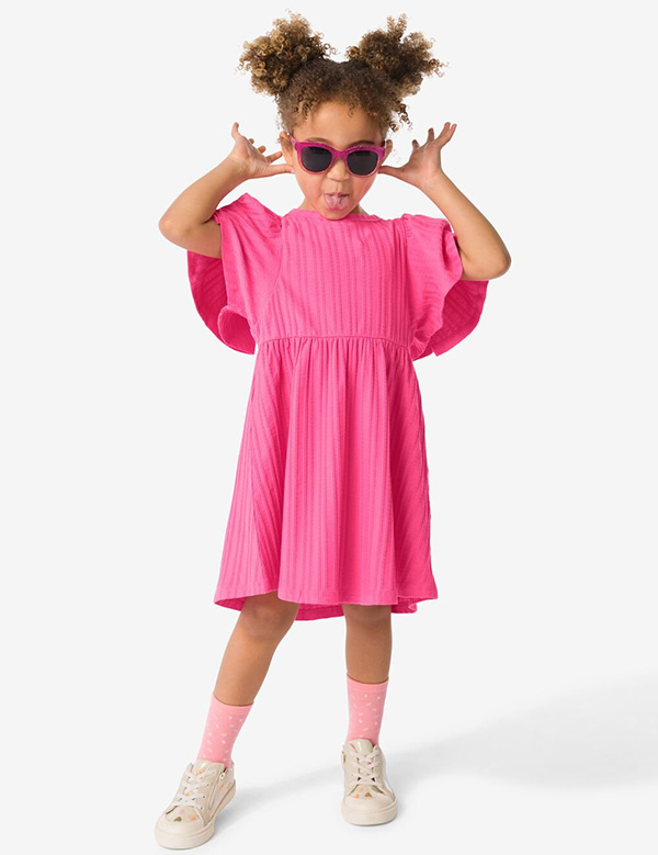 Kinderlijk model met bruin krullend haar Olivia V.
