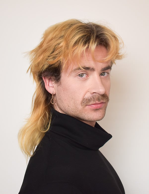 Mannelijk model met blond haar en blauw-groene ogen Floris W.