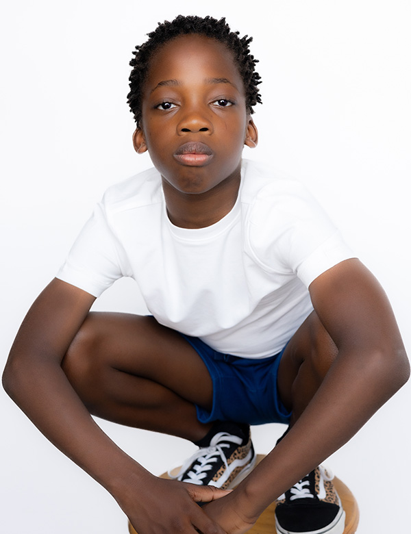 Kindermodel met zwart kroeshaar Nea M.