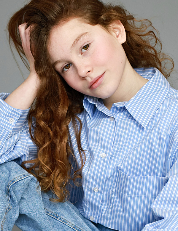 Kinderlijk model met roodbruin haar Quinthe.