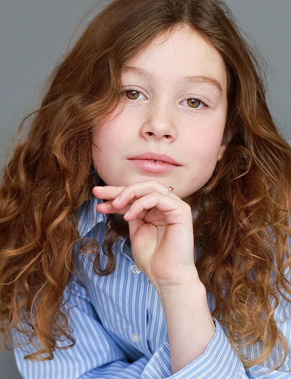 Kinderlijk model met roodbruin haar Quinthe.