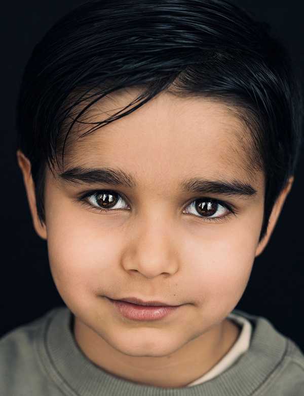 Kinderlijk model met bruin haar en bruine ogen Stan T.