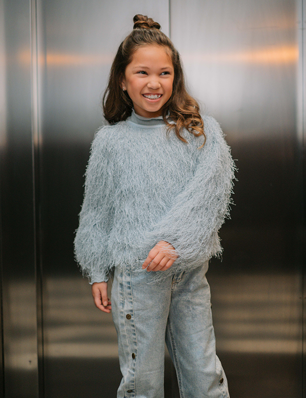 Kinderlijk model met bruin haar Aaliyah O.